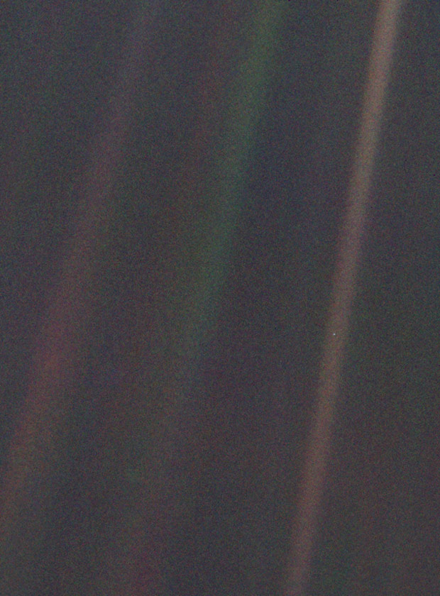 The famous photograph of Earth taken by the Voyager spacecraft on its way out of the solar system, in which Earth appears as a tiny, pale blue dot